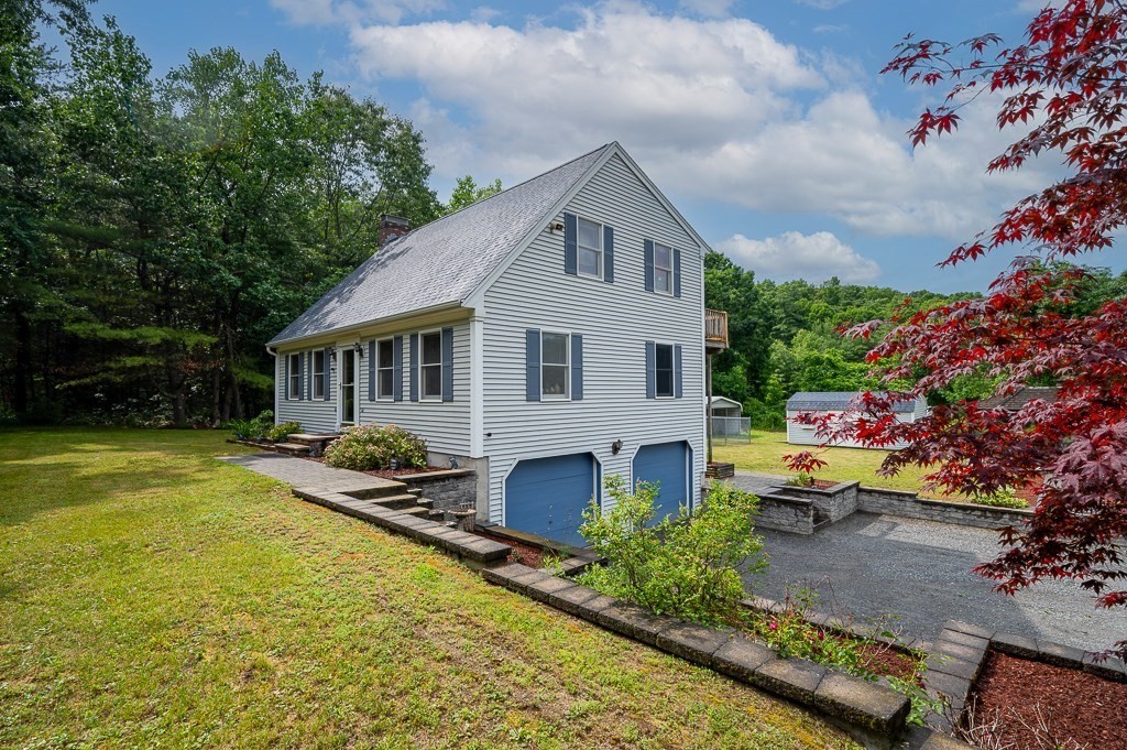 65 Lancaster Road Shirley, MA 01464 - Photo 1 of 42 a front view of house with outdoor space and sitting area