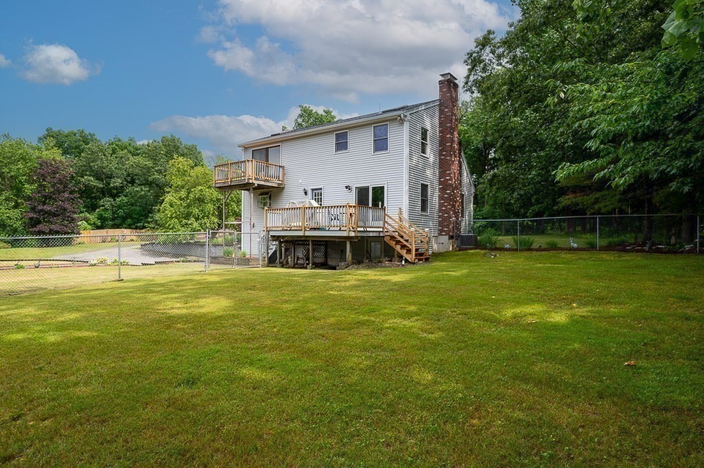 65 Lancaster Road Shirley, MA 01464 - Photo 15 of 42 a view of a house with a backyard