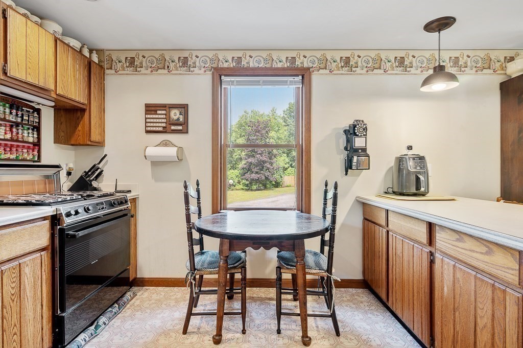 65 Lancaster Road Shirley, MA 01464 - Photo 17 of 42 a kitchen with stainless steel appliances granite countertop a stove a sink and a refrigerator