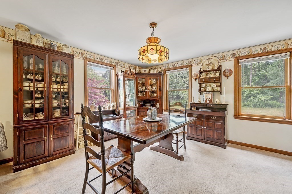 65 Lancaster Road Shirley, MA 01464 - Photo 20 of 42 a view of a dining room with furniture window and outside view
