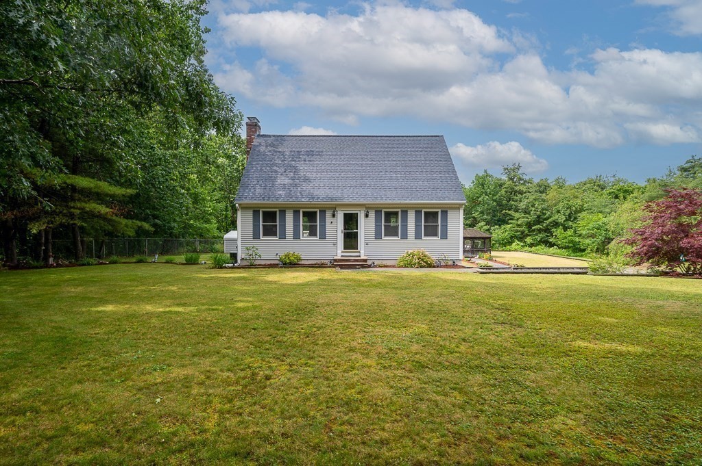 65 Lancaster Road Shirley, MA 01464 - Photo 2 of 42 a view of a house with a swimming pool