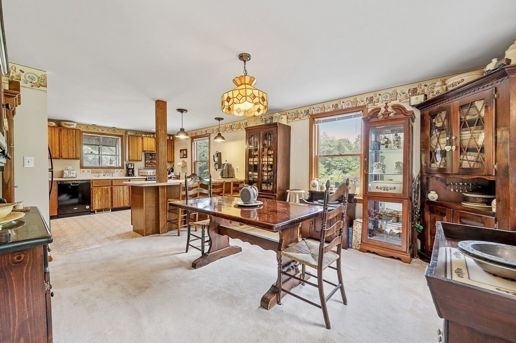 65 Lancaster Road Shirley, MA 01464 - Photo 21 of 42 a room with lots of furniture and natural light