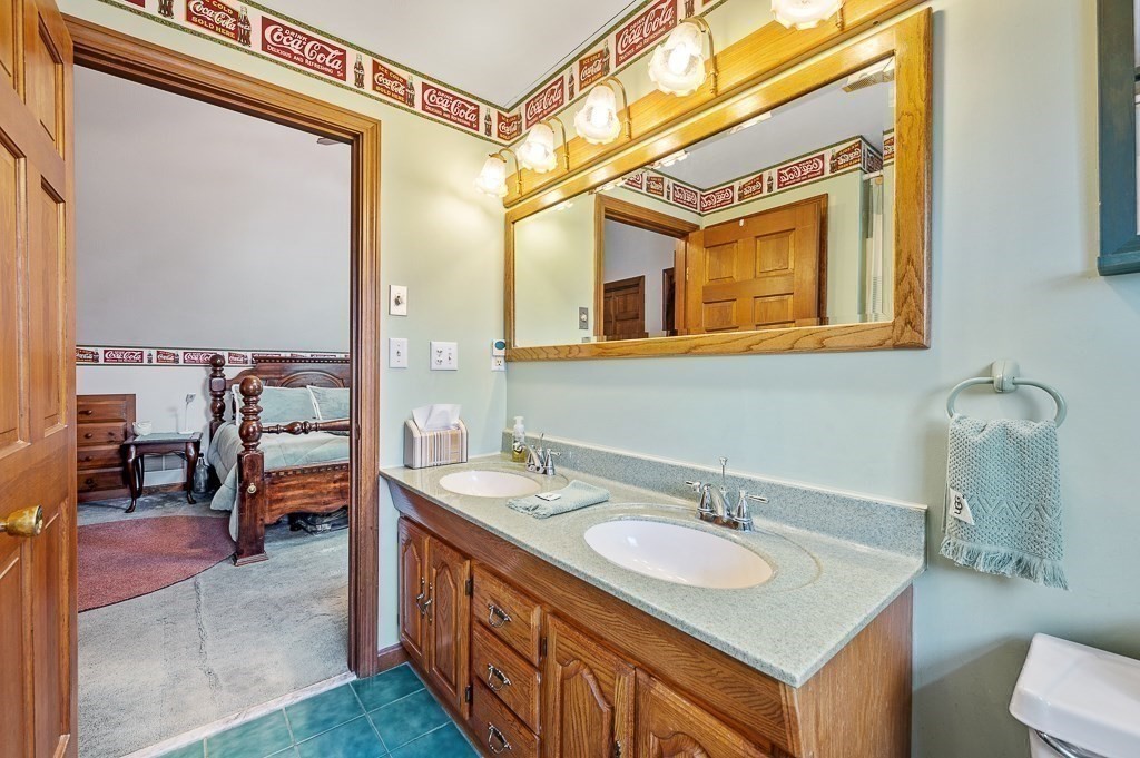 65 Lancaster Road Shirley, MA 01464 - Photo 25 of 42 a bathroom with a sink and a mirror