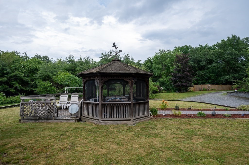 65 Lancaster Road Shirley, MA 01464 - Photo 31 of 42 a view of backyard with deck and outdoor seating