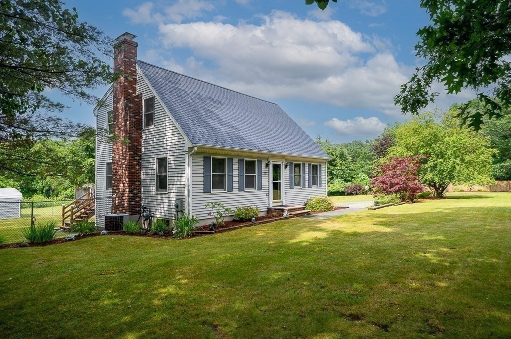 65 Lancaster Road Shirley, MA 01464 - Photo 33 of 42 a front view of a house with a garden