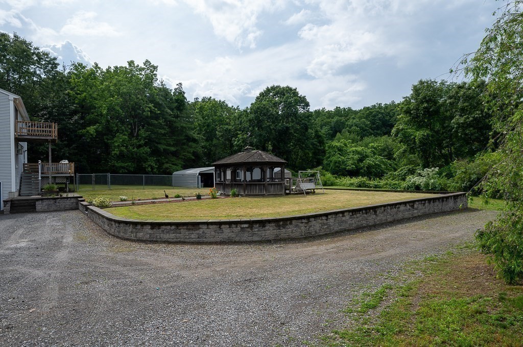 65 Lancaster Road Shirley, MA 01464 - Photo 35 of 42 a view of a swimming pool with a yard