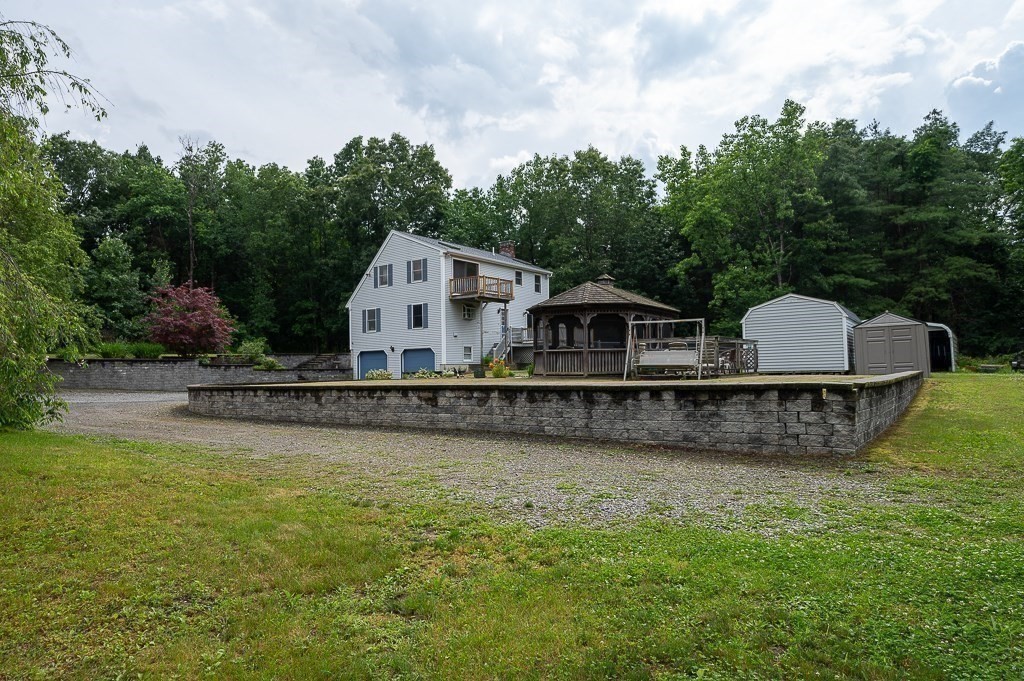65 Lancaster Road Shirley, MA 01464 - Photo 36 of 42 a front view of a house with a yard