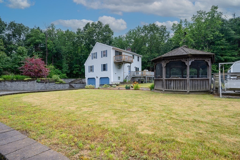 65 Lancaster Road Shirley, MA 01464 - Photo 38 of 42 a front view of a house with swimming pool