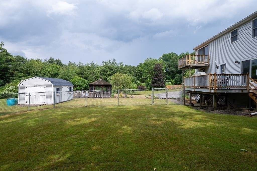 65 Lancaster Road Shirley, MA 01464 - Photo 39 of 42 a swimming pool with a yard in front of it