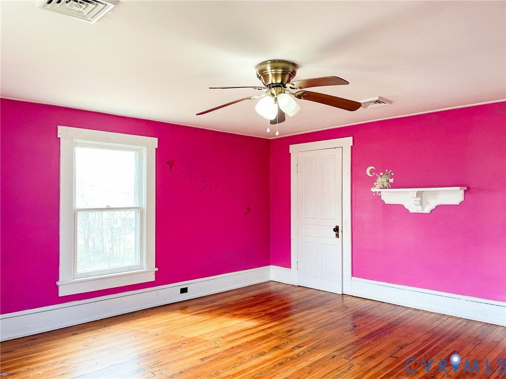 1016 Court Street Victoria, VA 23974 - Photo 25 of 29 a view of empty room with wooden floor and fan