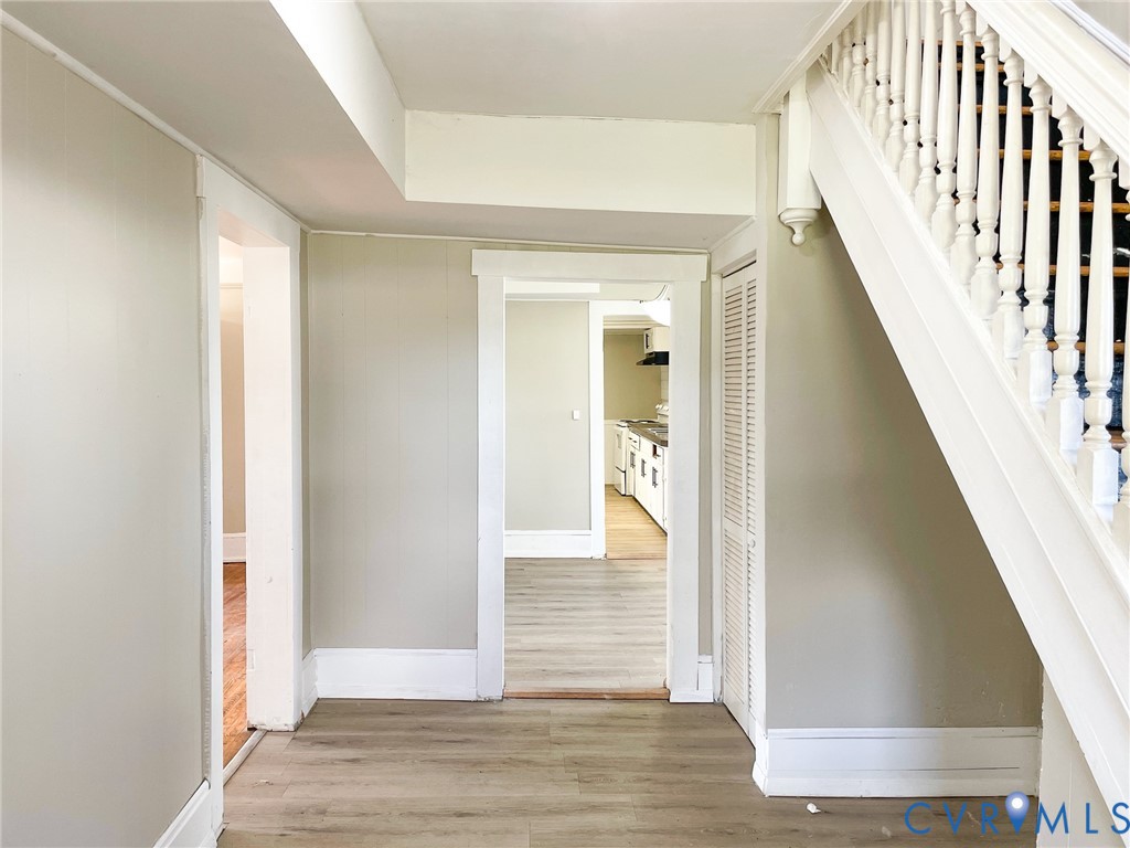 1016 Court Street Victoria, VA 23974 - Photo 3 of 29 a view of a hallway with wooden floor and staircase