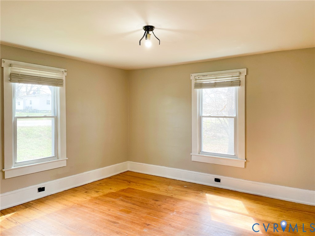 1016 Court Street Victoria, VA 23974 - Photo 4 of 29 a view of an empty room with a window and bathroom