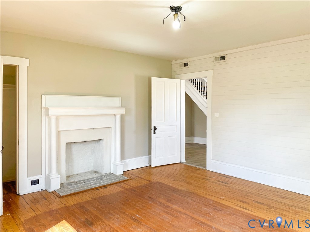 1016 Court Street Victoria, VA 23974 - Photo 6 of 29 a view of an empty room with closet and a fireplace