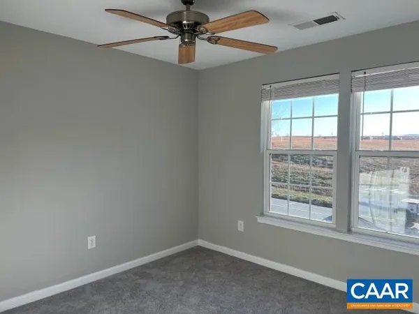 an empty room that has a window in it