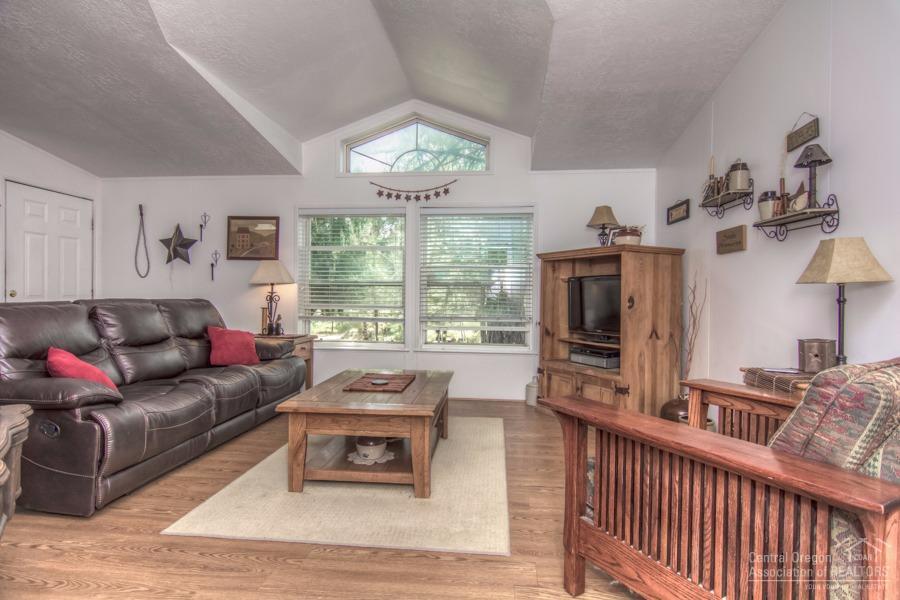 60041 Hopi Road Bend, OR 97702 - Photo 7 of 19 a living room with furniture and a flat screen tv