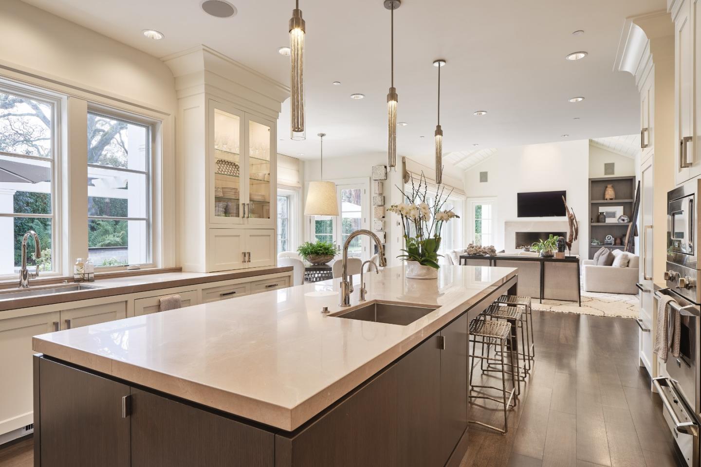 138 Almendral Avenue Atherton, CA 94027 - Photo 13 of 44 a kitchen with stainless steel appliances granite countertop a sink a oven and a large window