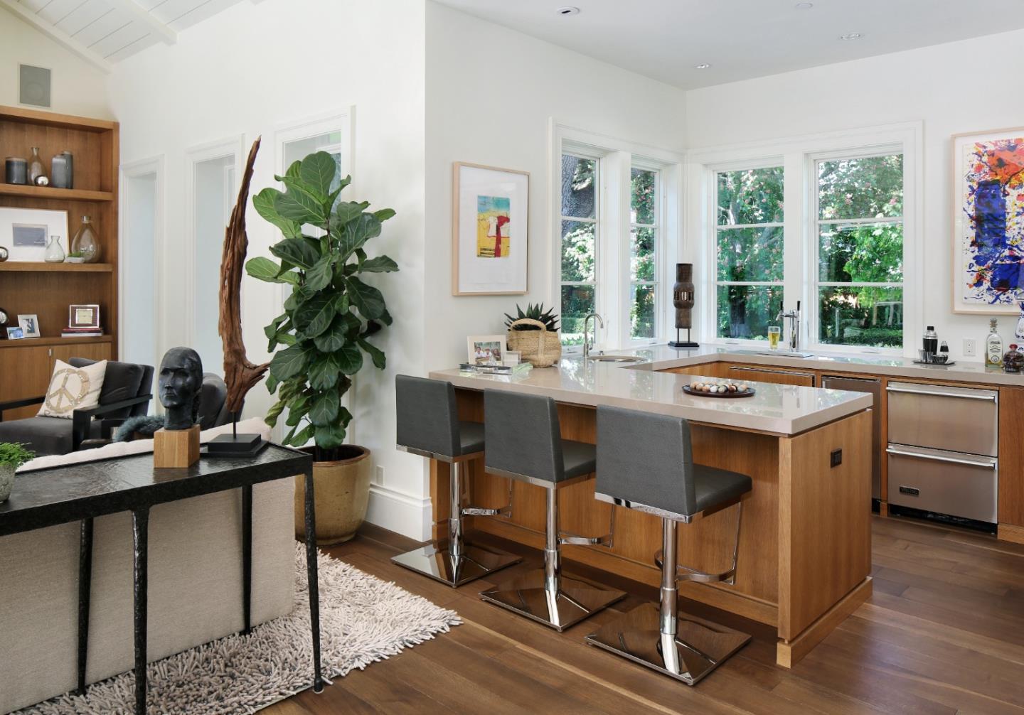 138 Almendral Avenue Atherton, CA 94027 - Photo 17 of 44 a dining room with a table chairs and a stove