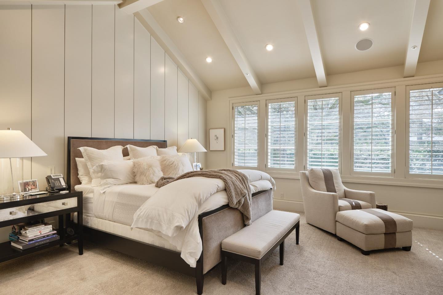 138 Almendral Avenue Atherton, CA 94027 - Photo 20 of 44 a spacious bedroom with a bed and a couch