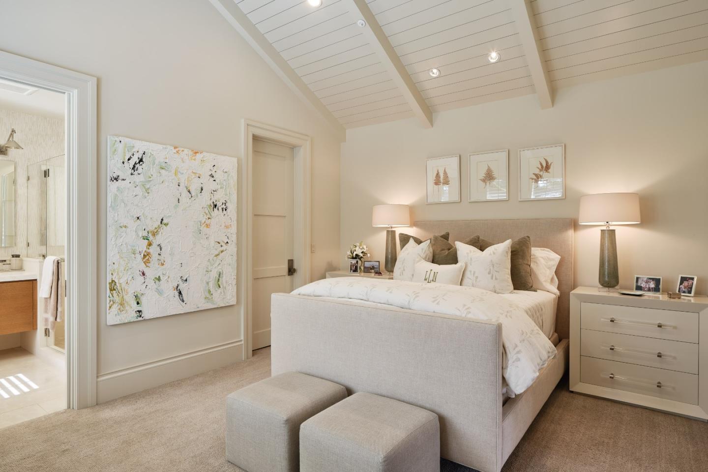 138 Almendral Avenue Atherton, CA 94027 - Photo 27 of 44 a spacious bedroom with a bed and a painting on the wall