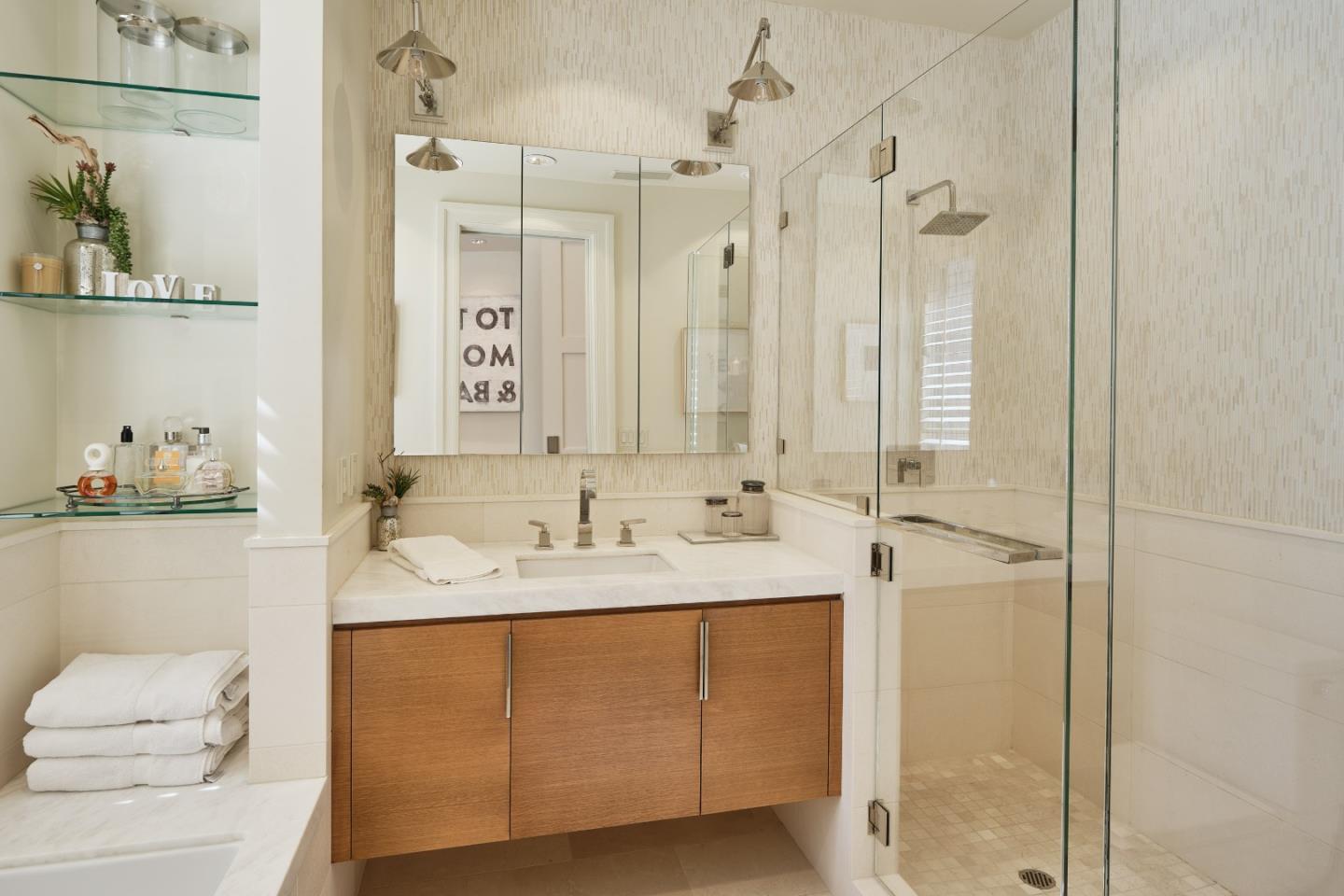 138 Almendral Avenue Atherton, CA 94027 - Photo 28 of 44 a bathroom with a sink and a mirror