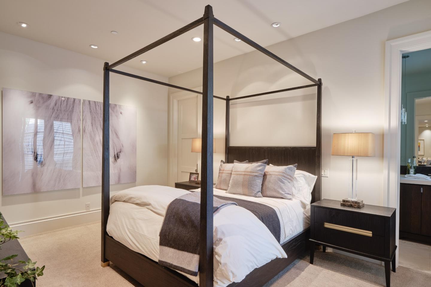 138 Almendral Avenue Atherton, CA 94027 - Photo 34 of 44 a bedroom with a bed and a lamp