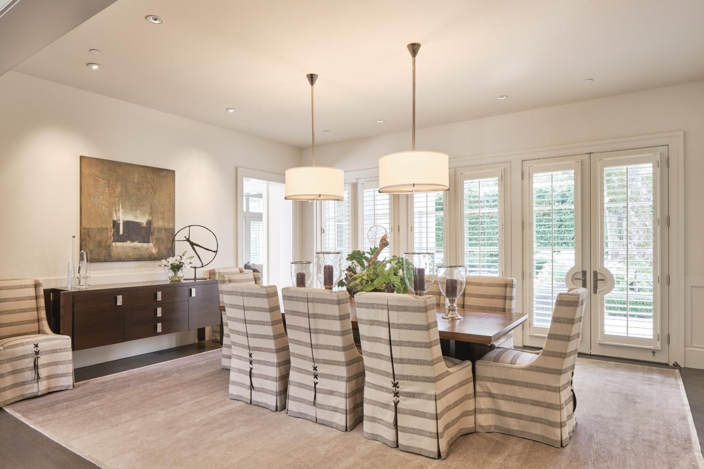 138 Almendral Avenue Atherton, CA 94027 - Photo 7 of 44 a living room with furniture a large window and chandelier