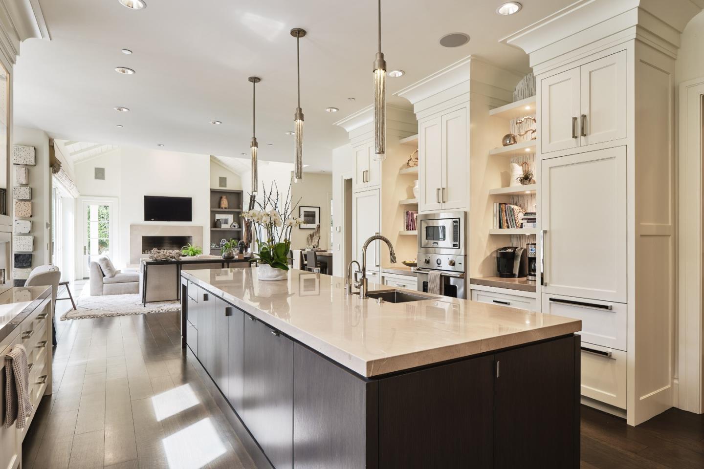138 Almendral Avenue Atherton, CA 94027 - Photo 10 of 44 a kitchen with stainless steel appliances a sink a stove a refrigerator and cabinets