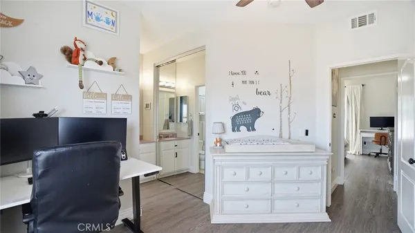 a spacious bathroom with a double vanity sink a mirror and a bathtub