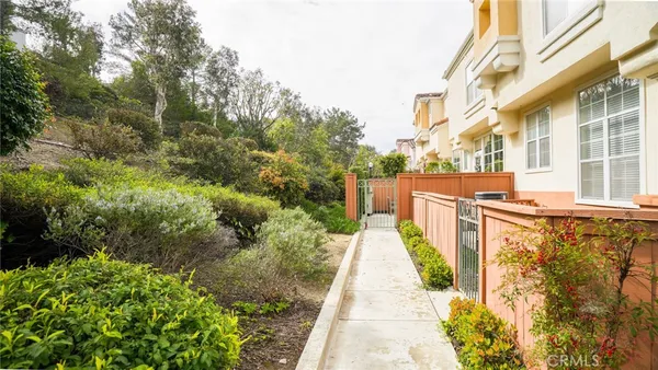a narrow alley leading to a building