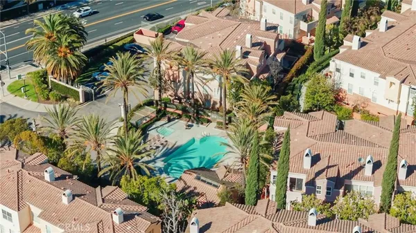 a swimming pool with outdoor seating and yard