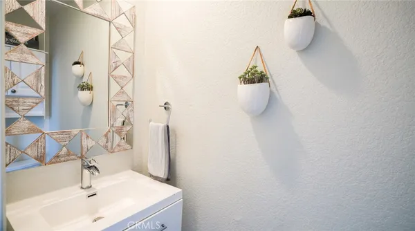 a bathroom with a sink and mirror