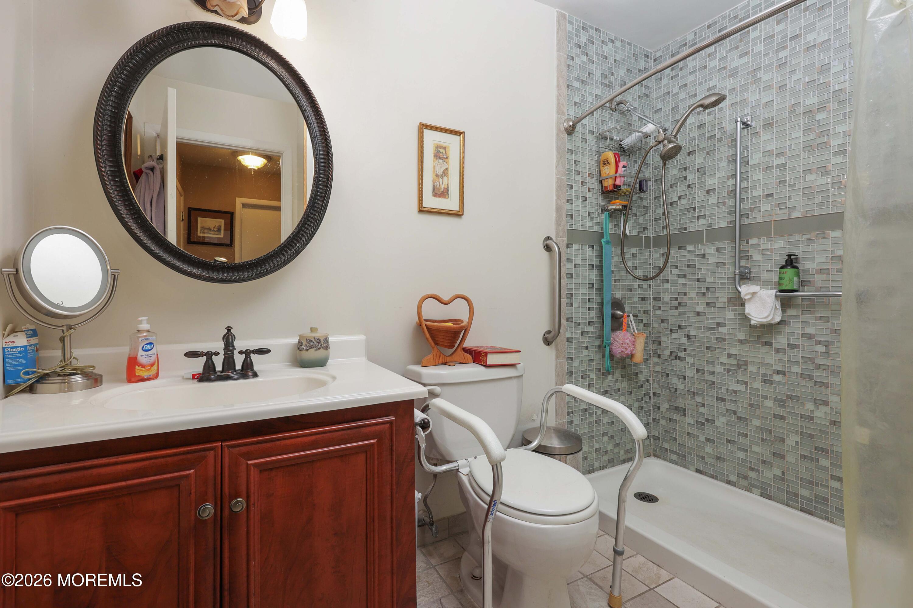 74 Sheffield Place Southampton, NJ 08088 - Photo 12 of 20 a bathroom with a sink a toilet and a mirror