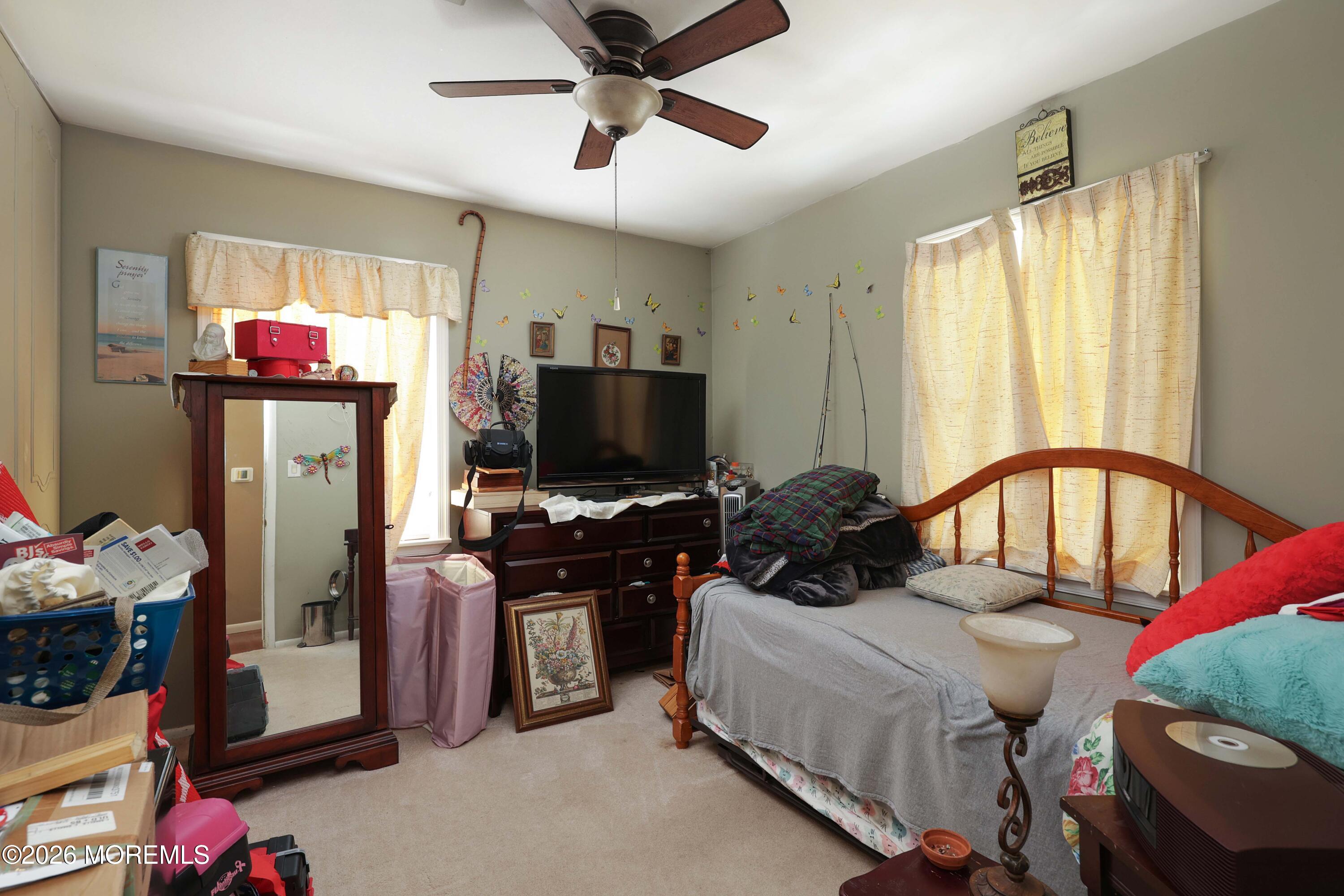 74 Sheffield Place Southampton, NJ 08088 - Photo 13 of 20 a bedroom with a bed a flat screen tv and a window