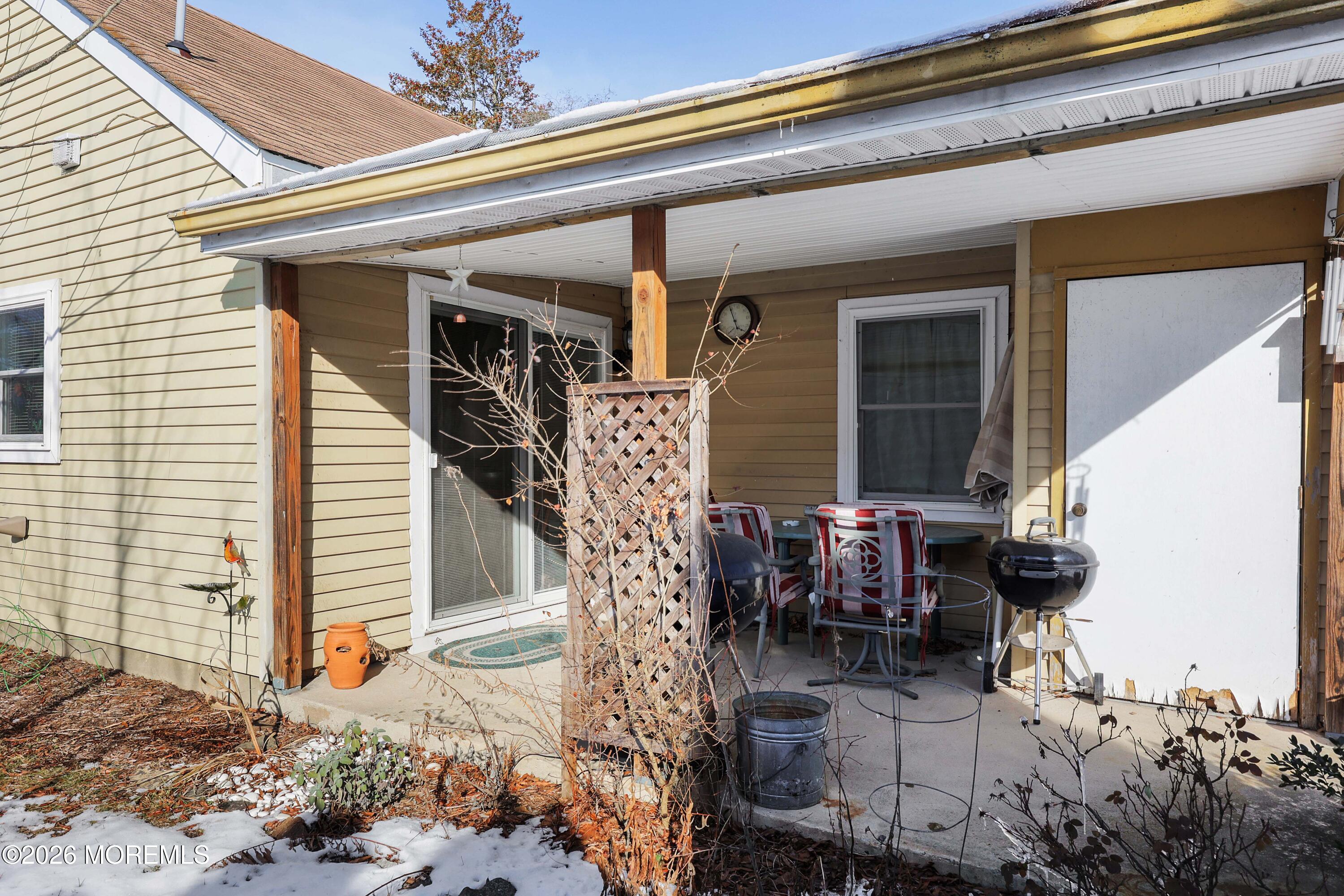 74 Sheffield Place Southampton, NJ 08088 - Photo 15 of 20 a view of a patio with table and chairs and potted plants