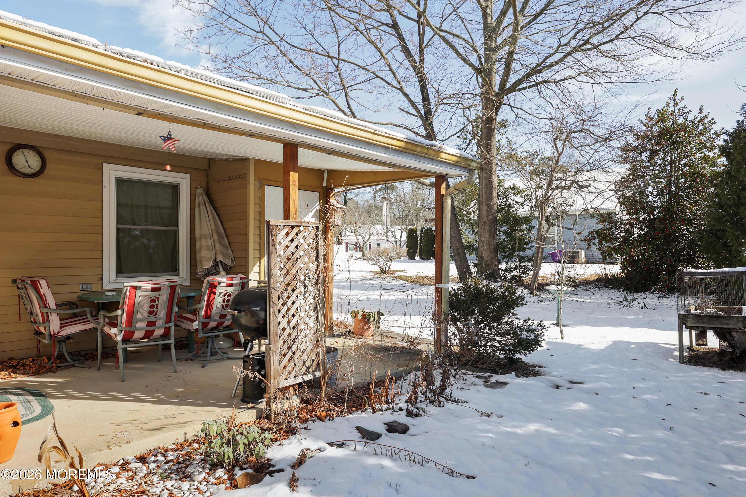 74 Sheffield Place Southampton, NJ 08088 - Photo 16 of 20 a view of a patio with table and chairs and potted plants