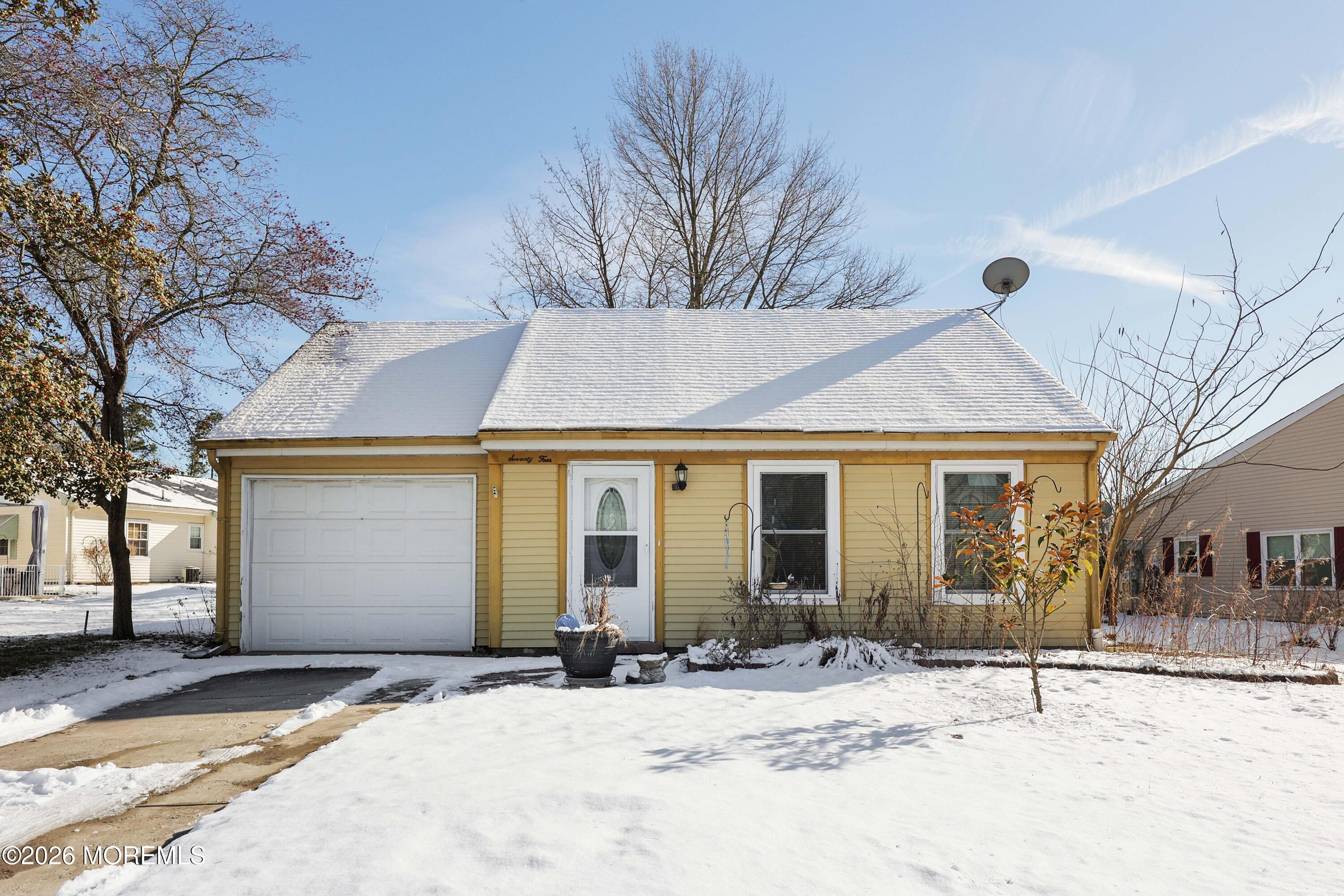 74 Sheffield Place Southampton, NJ 08088 - Photo 17 of 20 a view of a house with snow on the road