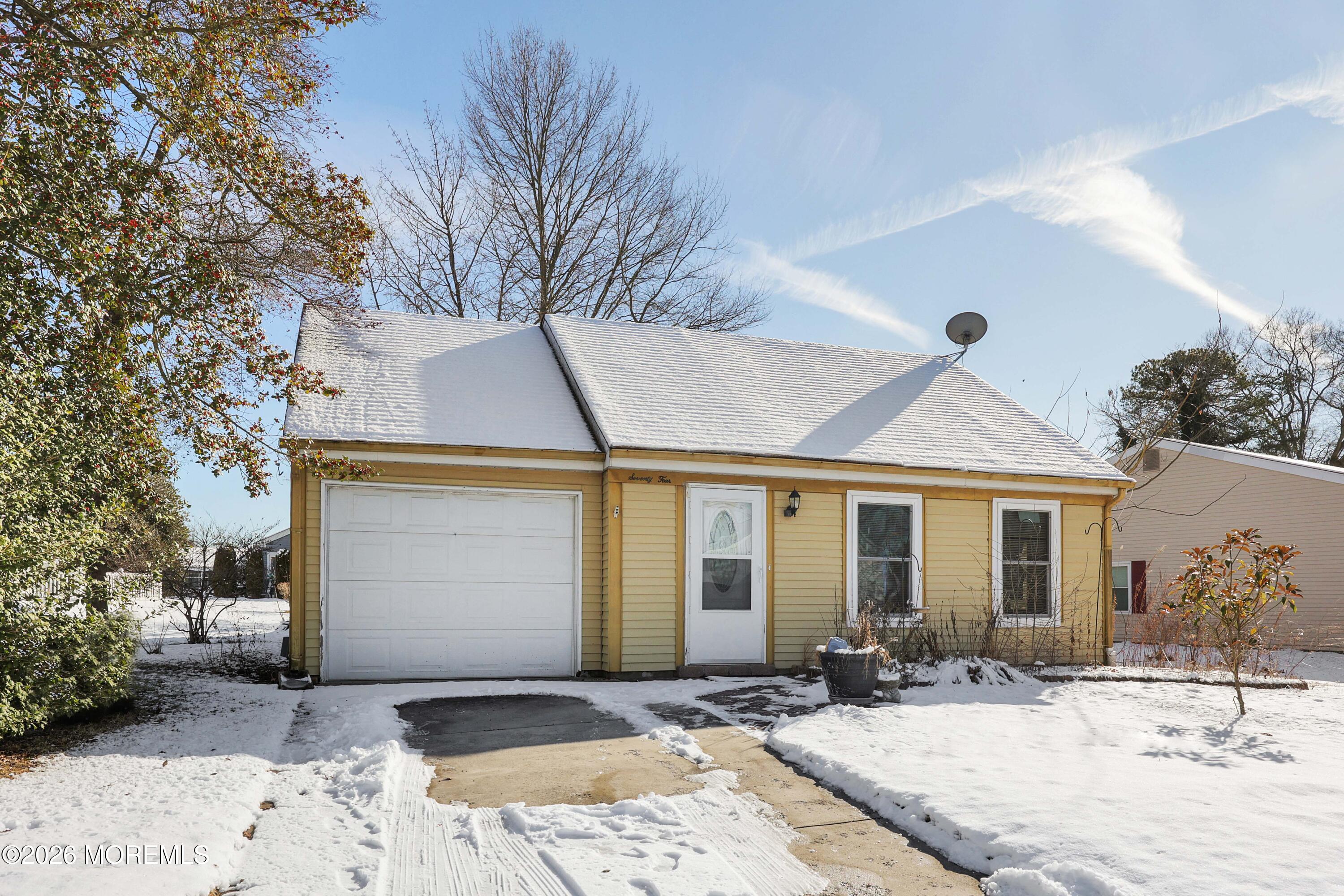 74 Sheffield Place Southampton, NJ 08088 - Photo 2 of 20 a front view of a house with a yard and glass windows