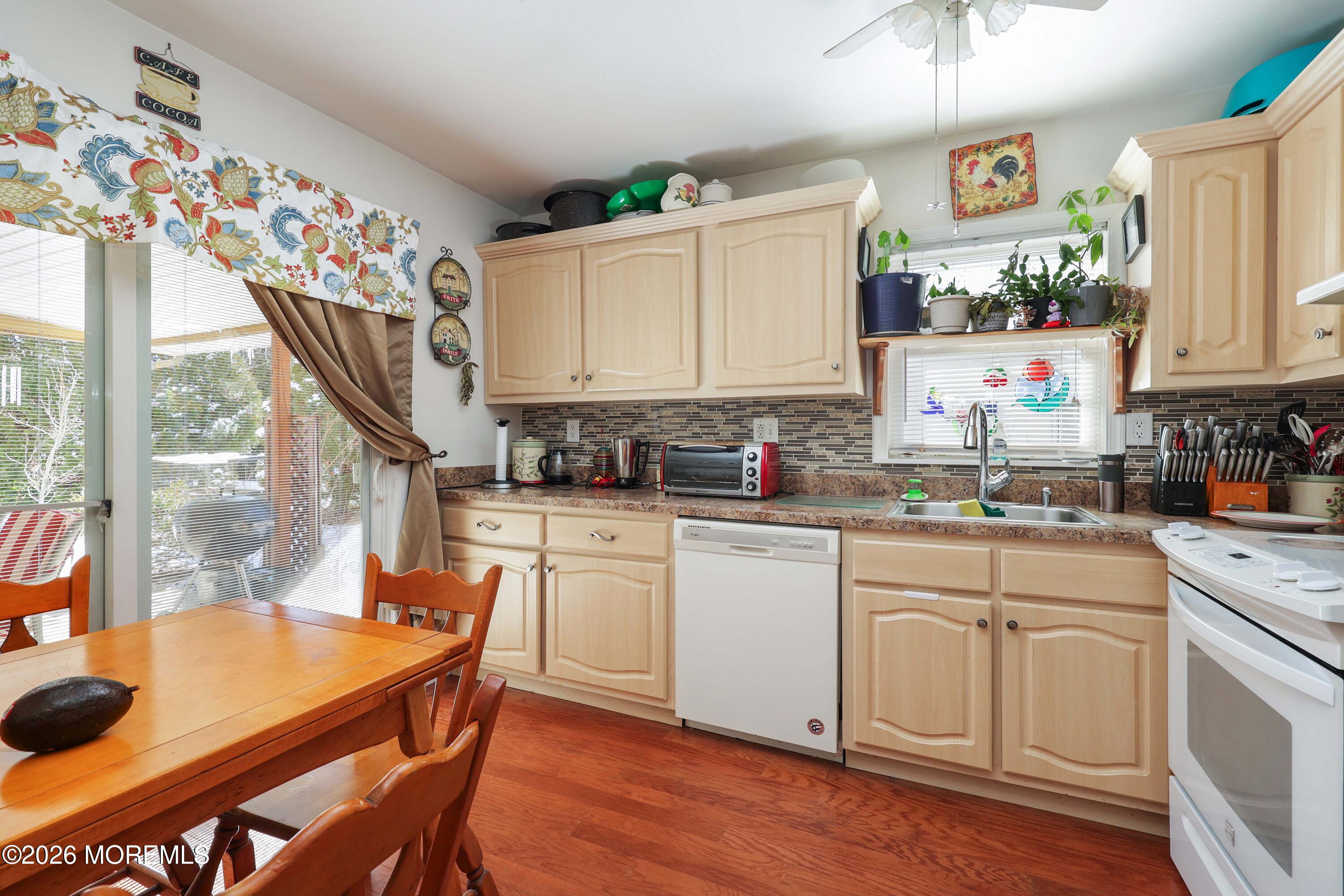 74 Sheffield Place Southampton, NJ 08088 - Photo 8 of 20 a kitchen with stainless steel appliances granite countertop a stove a sink dishwasher and cabinets with wooden floor