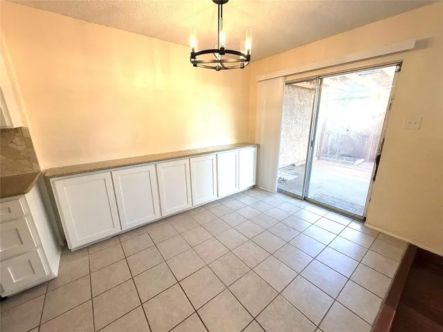 a view of a room with a large window