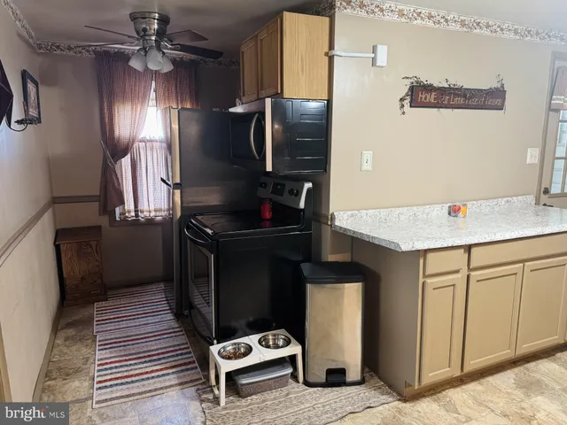 a kitchen with a sink cabinets and window