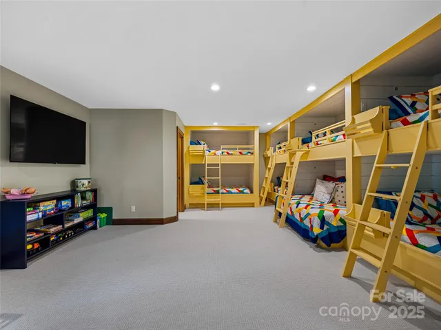 a bathroom with a granite countertop toilet sink and mirror