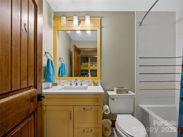 a view of living room kitchen with furniture and floor to ceiling window