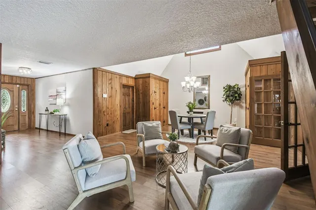 a spacious bedroom with a large bed and a large window