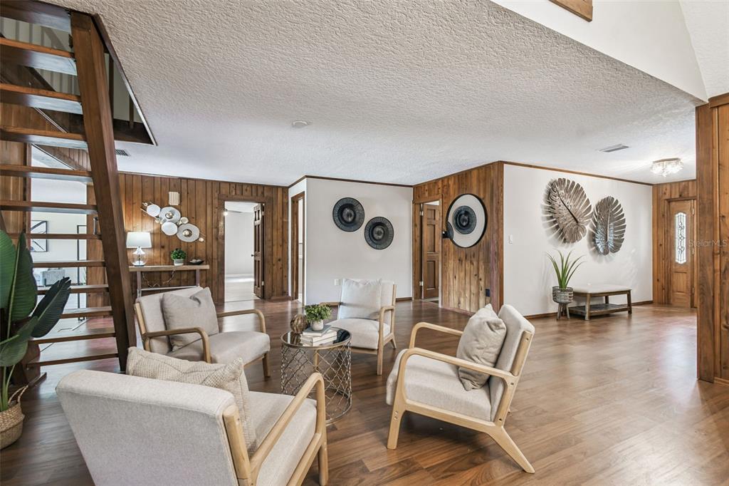 8011 North Mobley Road Odessa, FL 33556 - Photo 22 of 86 a living room with furniture and a large window