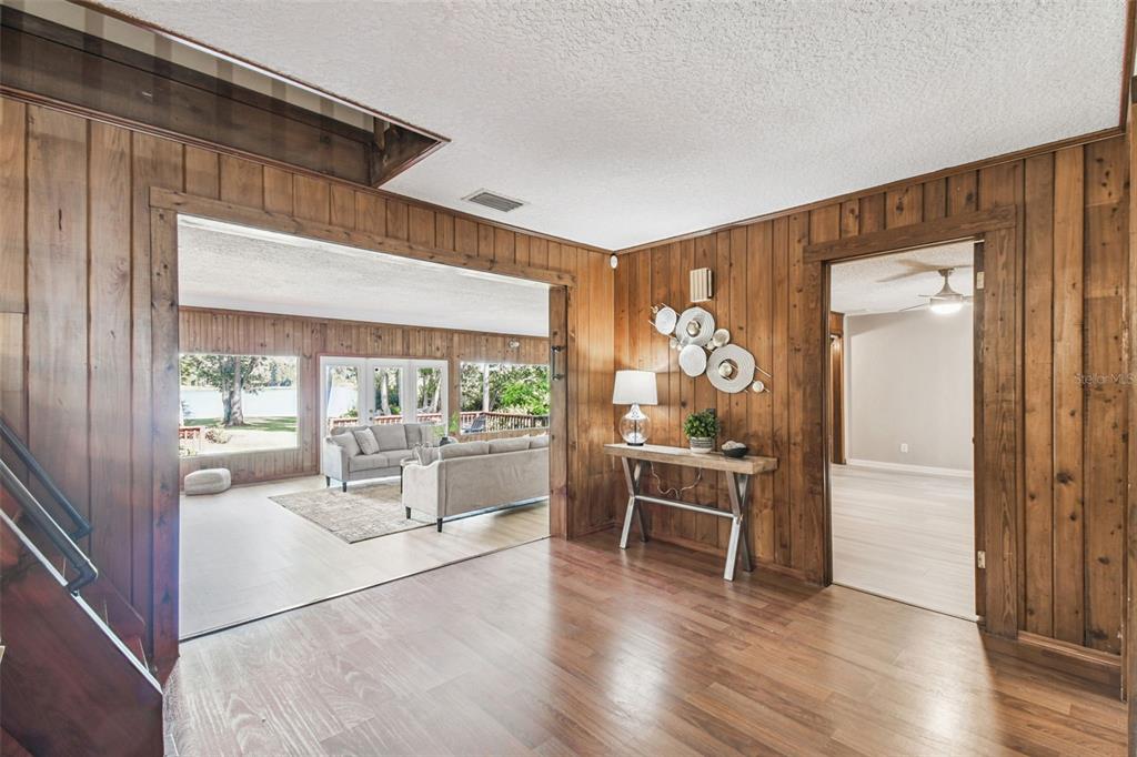 8011 North Mobley Road Odessa, FL 33556 - Photo 25 of 86 a dining room with wooden floor and furniture
