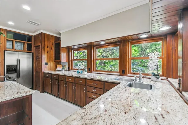 a view of a backyard with sitting area