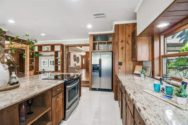 a view of a lake with houses in the back