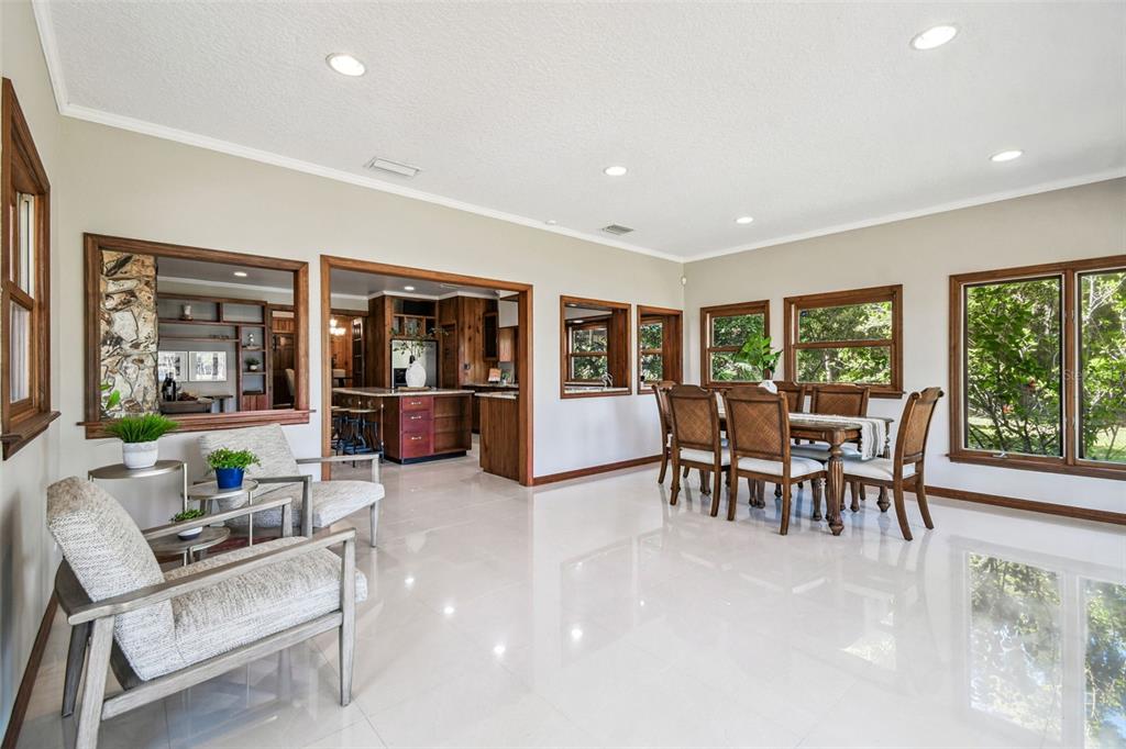 8011 North Mobley Road Odessa, FL 33556 - Photo 35 of 86 a living room with furniture and a table