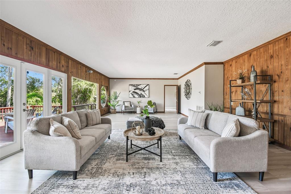 8011 North Mobley Road Odessa, FL 33556 - Photo 41 of 86 a living room with furniture and a large window