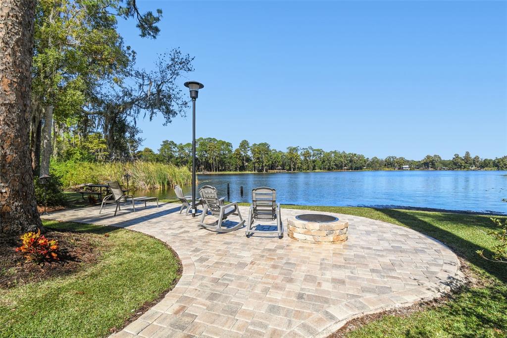 8011 North Mobley Road Odessa, FL 33556 - Photo 5 of 86 a view of a lake with a patio